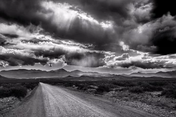 Fotobehang Straight road and storm © nickalbi