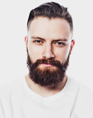 Obraz premium Young bearded man over white background. Lifestyle and people concept.