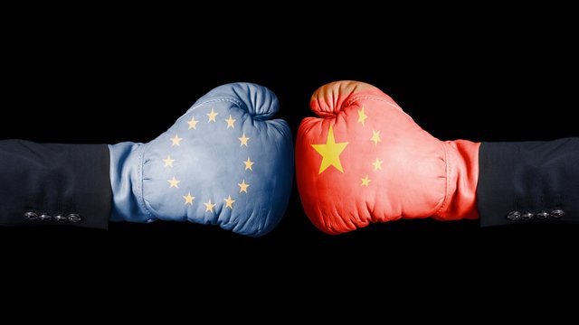 Boxing gloves with European Union and China flag. European Union versus China concept.