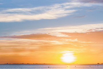 Fototapeta premium Beautiful summer sunset with clouds over the sea