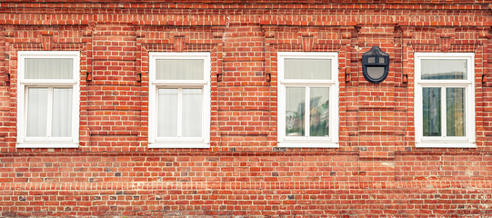 Banner with red brick wall and white vintage Windows