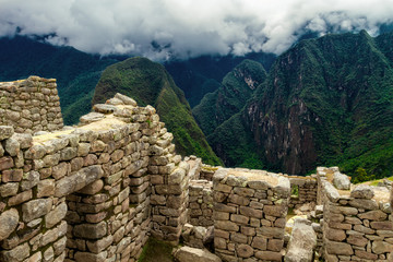 Valley on the side of Machu Picchu seen on the walls of the housing area