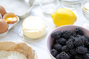 Raw ingredients for cooking blackberry pie, closeup. Side view.