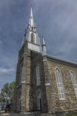 Fototapeta na wymiar View of Church of St. Patrick (Eglise de Saint-Patrice, 1833) in Village Riviere-du-Loup (200 kilometers east of Quebec City). Quebec province, Canada.