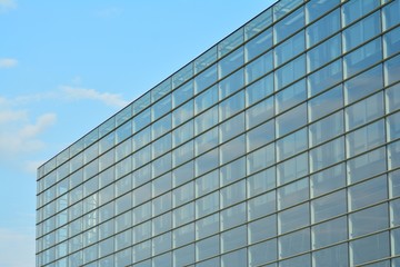 Fototapeta na wymiar Urban abstract background, detail of modern glass facade, office business building