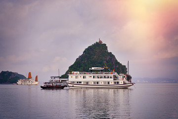 Halong bay boats,Sunset at Ha Long Bay scenic view , Hanoi, Vietnam