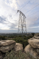 Electric power tower nestled in rocks above the western San Fernando Valley in Los Angeles, California.  