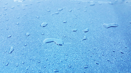 Water Drops background on the glossy surface