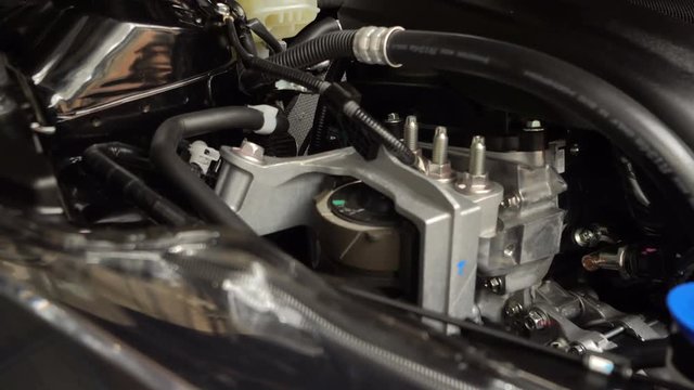 Closeup detailed view of new car engine compartment, Dolly shot
