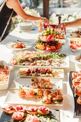 Tuinposter Catering food wedding. Appetizer and snacks © Jukov studio