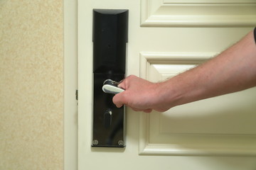 Hand closing hotel door