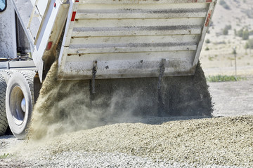 Dump Truck spreading Gravel on Driveway © Pamela Au