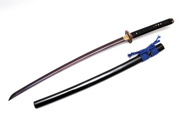 Japanese sword and scabbard on white background