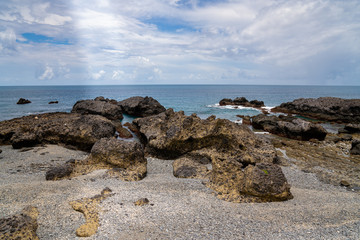 Fototapeta na wymiar Vulcanic rocks at the tropical island beach
