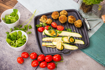Zucchini and meatloaf on the grill pan