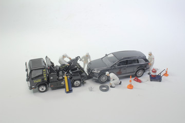 a worker figure with the tow truck