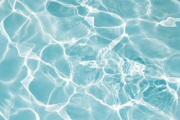 Texture of water in swimming pool for background