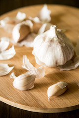 Wooden plate with garlic