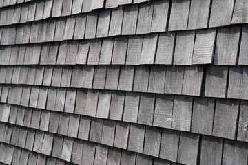 Wooden grey shingles of a roof