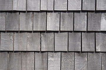 Wooden grey shingles of a roof