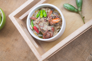 Salted crab stew with coconut milk served with vegetables