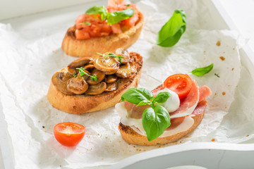 Fresh various bruschetta with fresh ingredients for breakfast