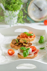 Homemade and fresh various bruschetta with fresh ingredients