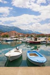 Fototapeta na wymiar Fishing boats in harbor. Montenegro, Tivat city, view of Marina Kalimanj