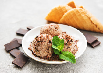 Chocolate ice cream on a stone background