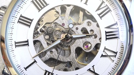 Old vintage analog clock mechanism watch time going fast, closeup detail timelapse time running fast