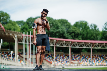 African american male athlete sexy sport bare torso man with running sports arm case for mobile...