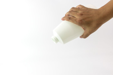 White plastic bottle with spiral on top mouth in the hand of man