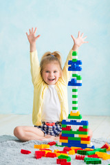 the girl built a tower of cubes. The joy of games