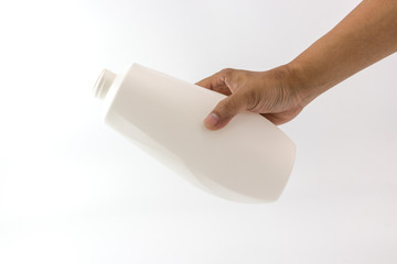 White plastic bottle with spiral on top mouth in the hand of man