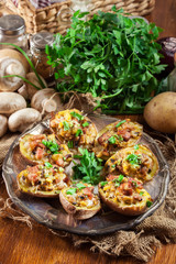 Baked potatoes stuffed with bacon, mushrooms and cheese