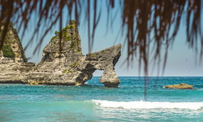 stunning beautiful tropical island paradise landscape shot under beach straw umbrella panorama view of rocks on an amazing turquoise sea water color