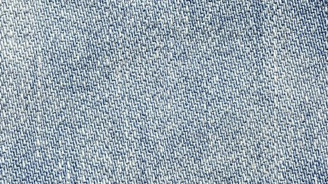 Blue denim jeans close up 4K stock footage. dolly shot, sliding camera move.