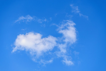 White clouds in the vast blue sky. Abstract nature background.