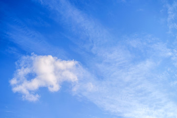 White clouds in the vast blue sky. Abstract nature background.