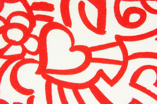 Fabric with red pattern and with heart. Background.