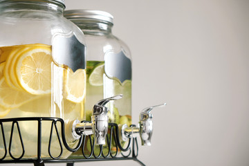Fresh citrus lemonade with lemons and limes in beverage dispenser