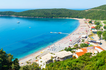 View from above on Adriatic sea coastline and Jaz beach at Montenegro, nature landscape, vacations to the summer paradise