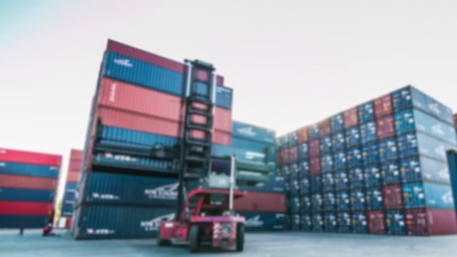 View blur 4K Time lapse of Container yard on blue sky.