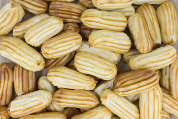 A lot of real fresh soft delicious eclairs cooked in the restaurant by a confectioner