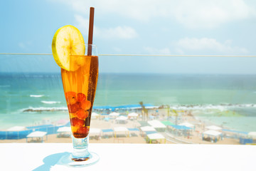  Cocktail drink on wood table on the sky background. Chill out and summer holiday concept