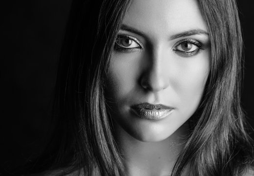 Black and white portrait of beautiful young woman. Selective focus.