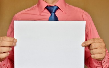 man holding a blank sheet
