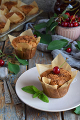 Muffin from flax seeds, millet and rice flour with cherries. Homemade baking. Organic healthy vegetarian food. Gluten free. Dairy free. Grain free pastries. Rustic photo. Copy space