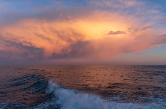 Stormy clouds of contrasting color over sea