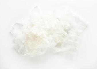 Heap of plastic garbage: bags, containers for recycling on white background. Top view